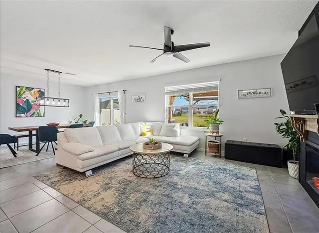 a living room with furniture and a window
