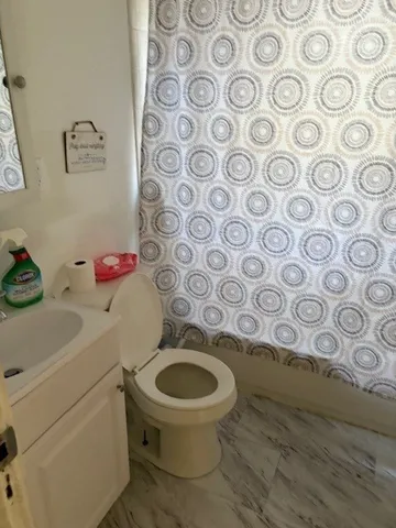 a bathroom with a toilet and a sink