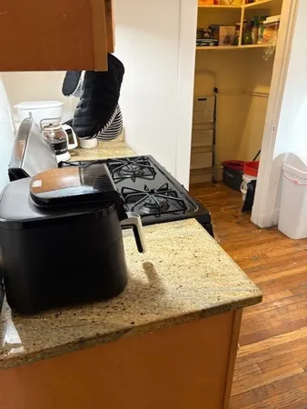 a kitchen with a stove and a refrigerator