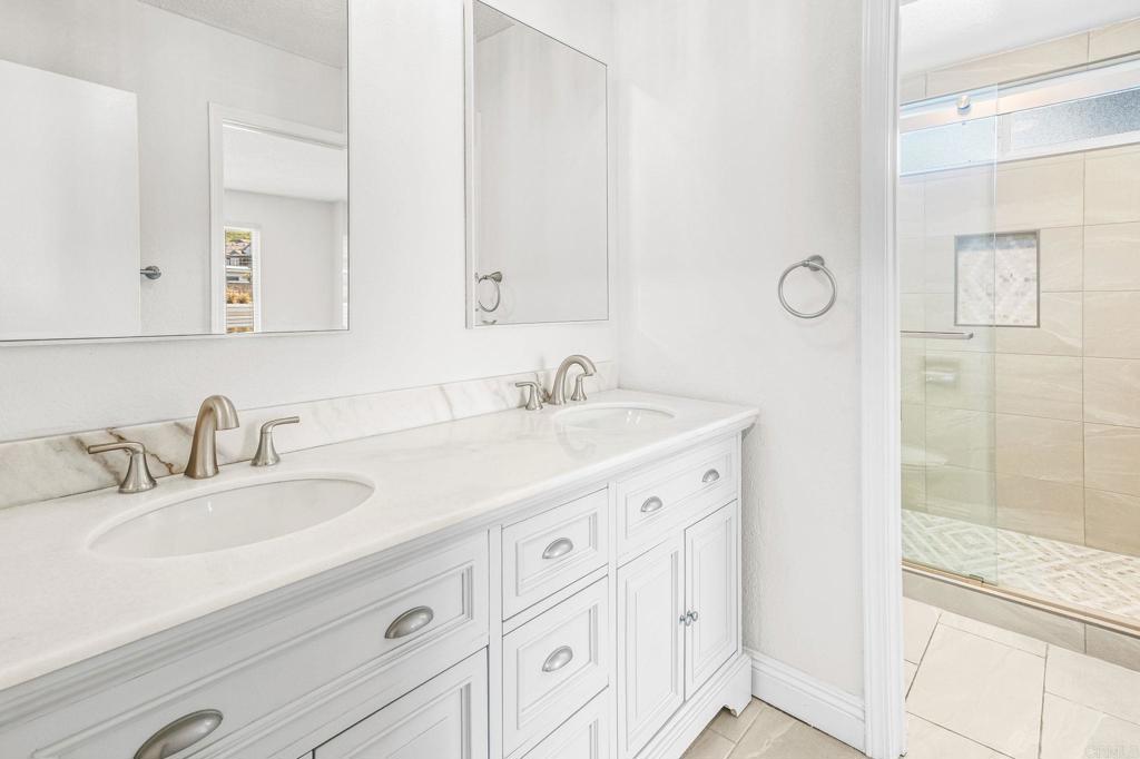 965 Jamacha Road El Cajon, CA 92019 - Photo 16 of 28 a bathroom with double sink and a mirror