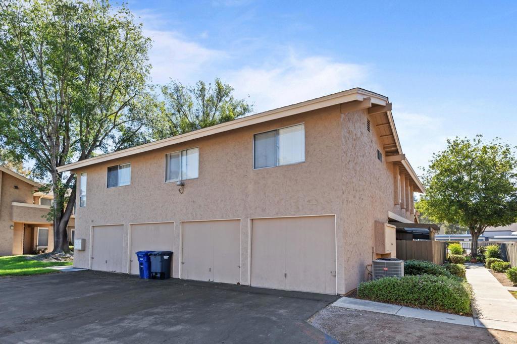 965 Jamacha Road El Cajon, CA 92019 - Photo 19 of 28 a house that has a tree in front of it