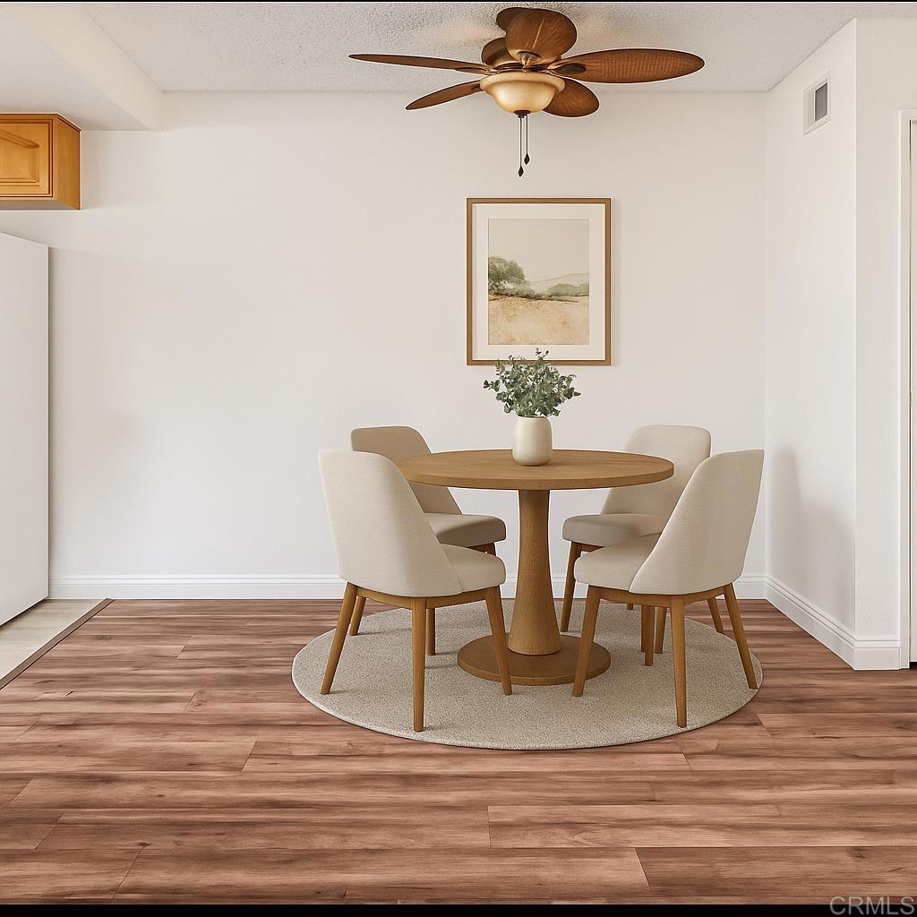 965 Jamacha Road El Cajon, CA 92019 - Photo 21 of 28 a view of a dining room with furniture and wooden floor