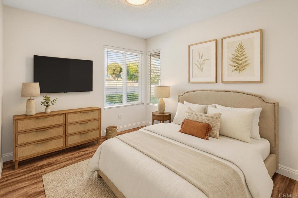 965 Jamacha Road El Cajon, CA 92019 - Photo 24 of 28 a bedroom with a bed and a flat screen tv