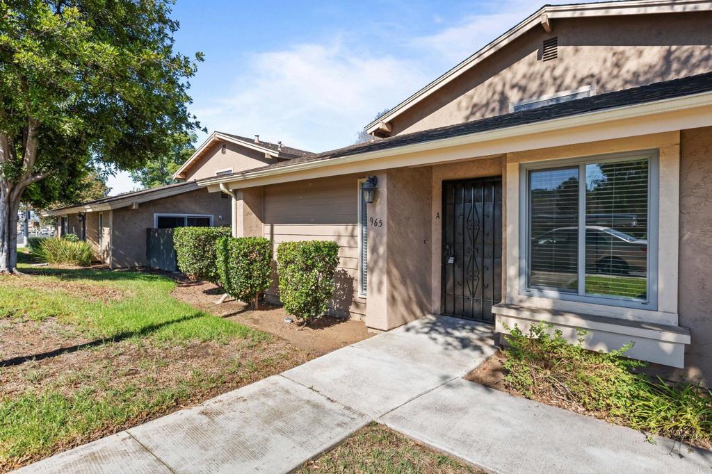 965 Jamacha Road El Cajon, CA 92019 - Photo 3 of 28 a front view of a house with garden