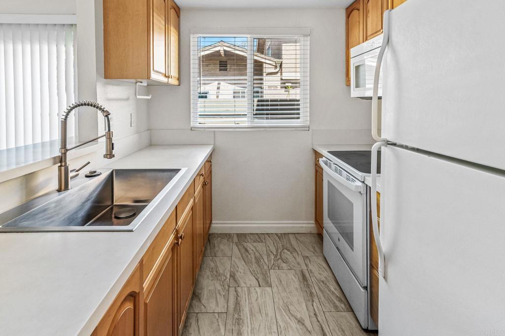 965 Jamacha Road El Cajon, CA 92019 - Photo 7 of 28 a kitchen that has a sink and a stove