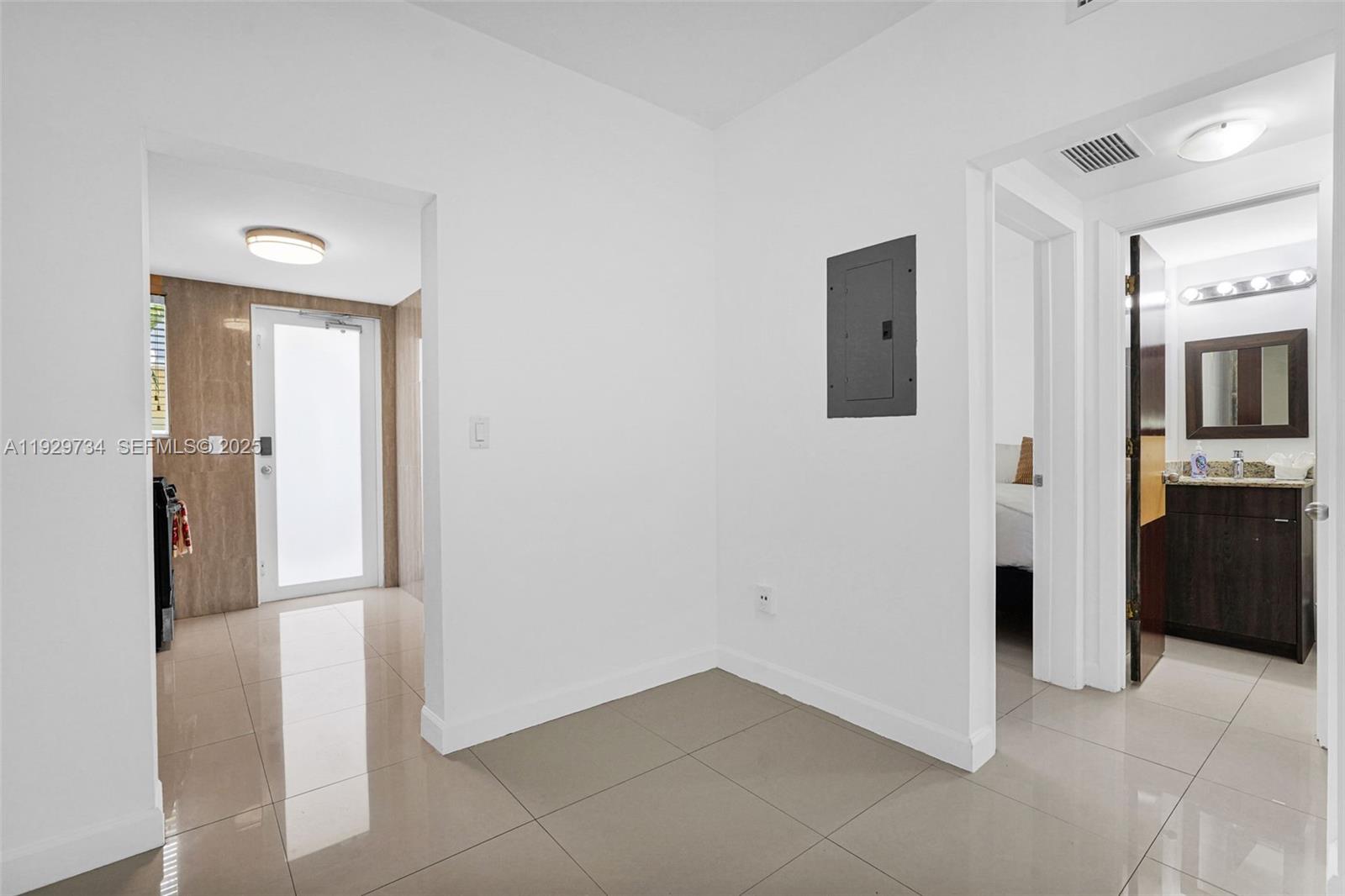1025 94th Street, Unit 9 Bay Harbor Islands, FL 33154 - Photo 17 of 21 a view of a hallway with some storage area