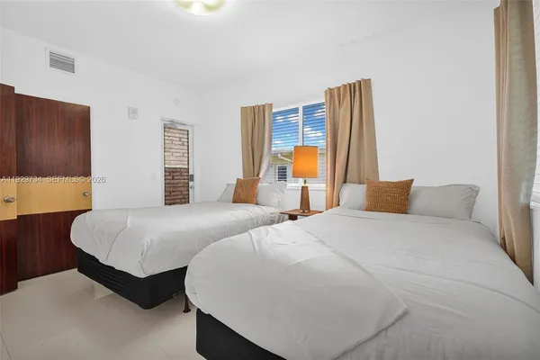 a bedroom with a bed and a closet