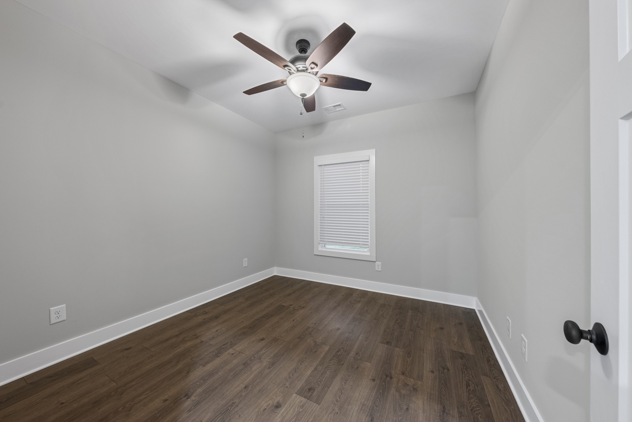 2624 South Main Street, Unit 7 Springfield, TN 37172 - Photo 22 of 37 an empty room with wooden floor and ceiling fan