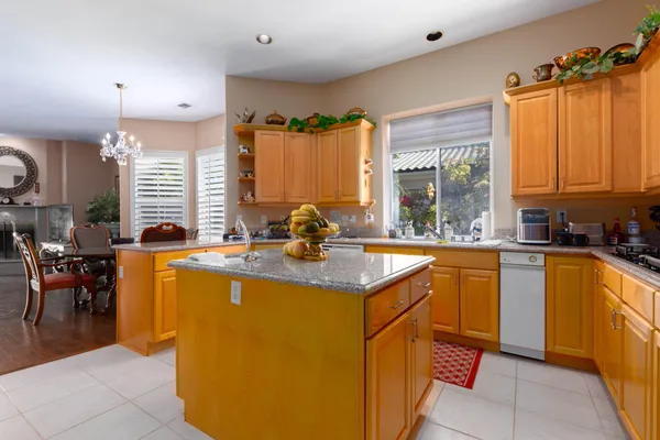 a kitchen with a sink and a large window