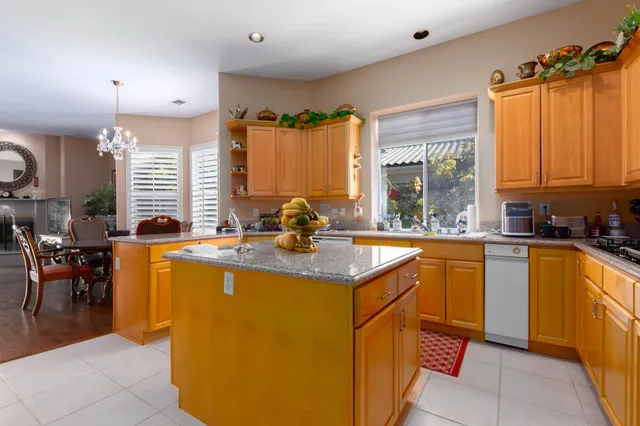a kitchen with a sink and a large window