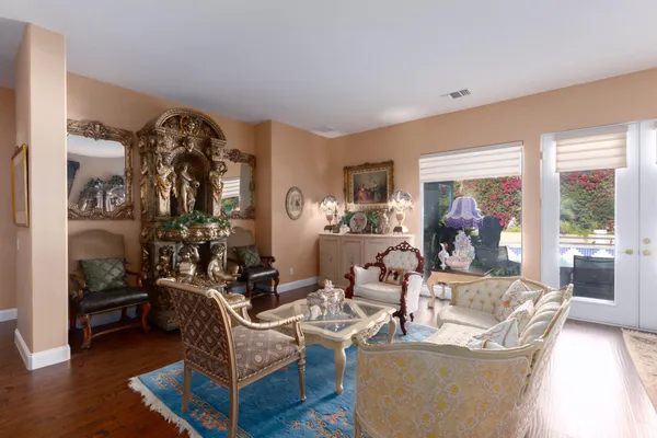a living room with furniture and a large window