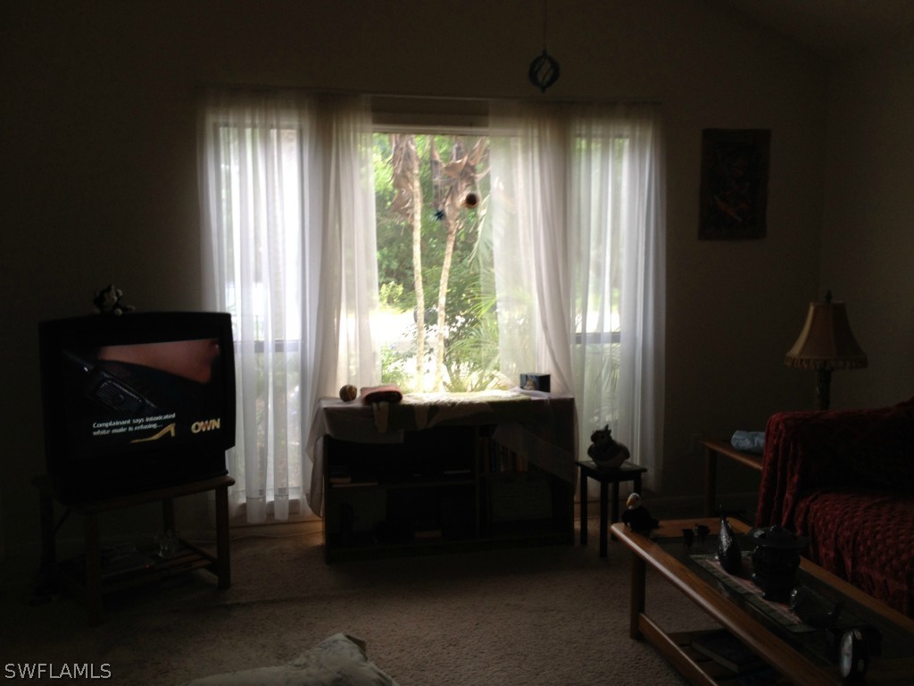 7431 Albany Road Fort Myers, FL 33967 - Photo 8 of 14 a room with furniture and a window