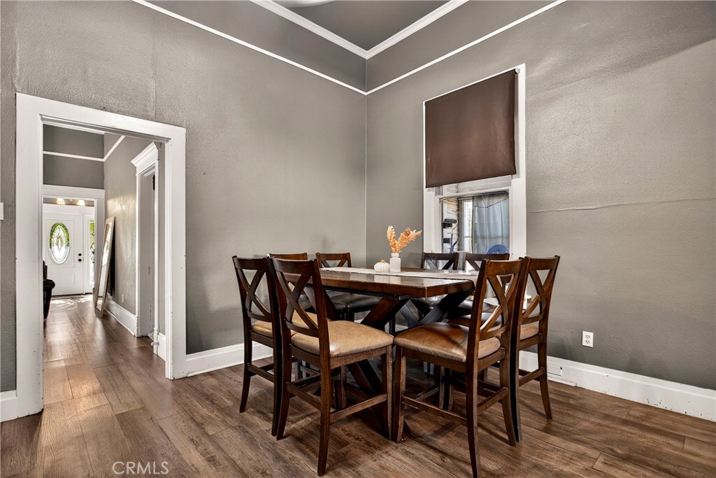 1214 Marin Street Corning, CA 96021 - Photo 16 of 57 a view of a dining room with furniture and wooden floor