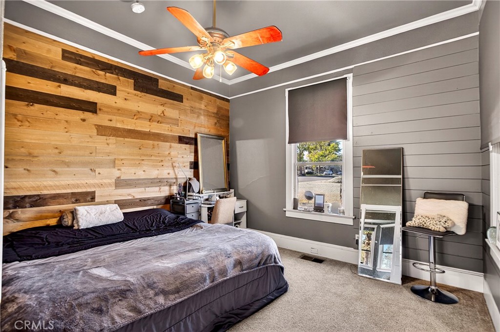 1214 Marin Street Corning, CA 96021 - Photo 19 of 57 a bedroom with a bed and large windows