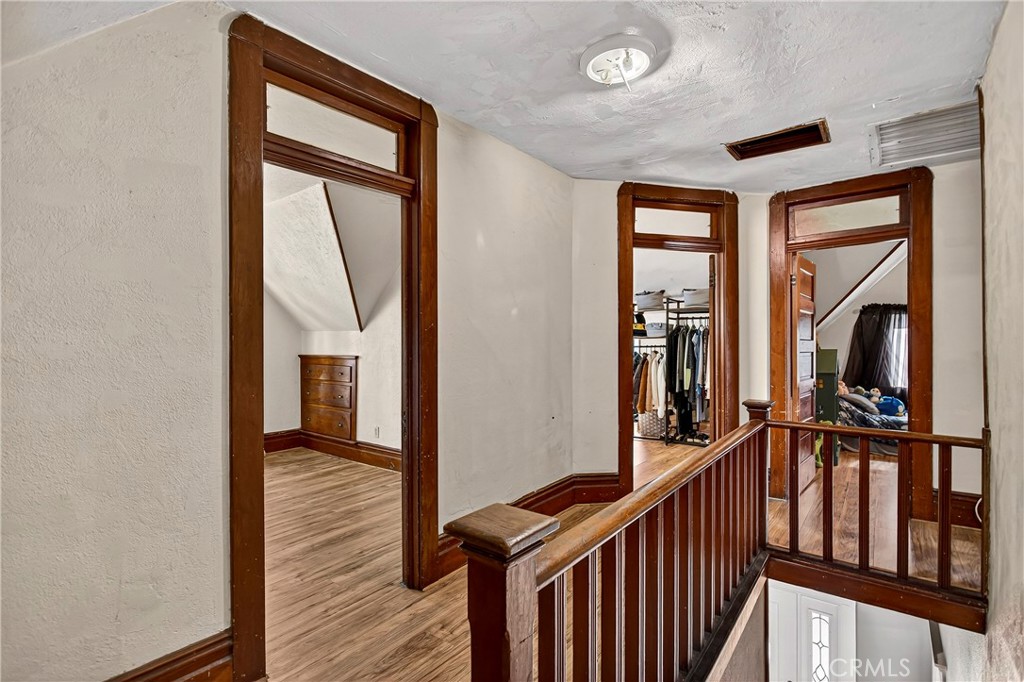 1214 Marin Street Corning, CA 96021 - Photo 28 of 57 a view of a hallway with wooden floor and staircase