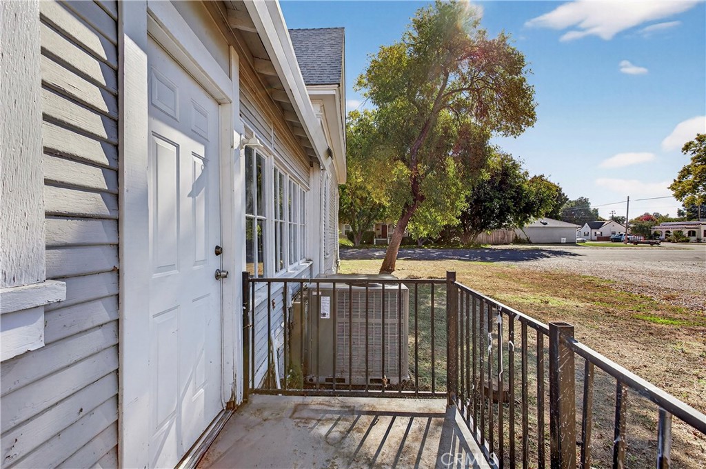 1214 Marin Street Corning, CA 96021 - Photo 41 of 57 a view of a balcony with wooden floor and fence