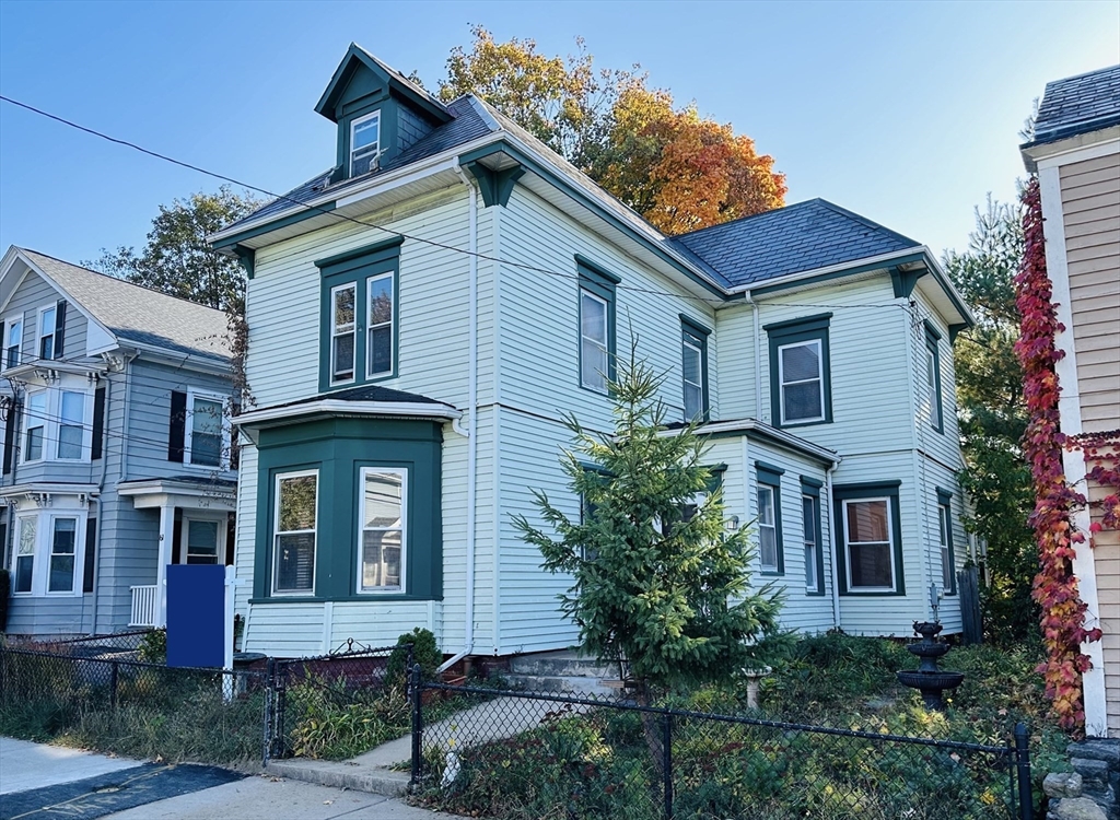57 Church Street Watertown, MA 02472 - Photo 1 of 18 a front view of a house with garden