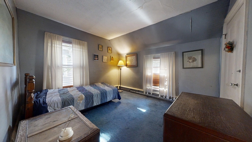 57 Church Street Watertown, MA 02472 - Photo 11 of 18 a bed room with bed and window
