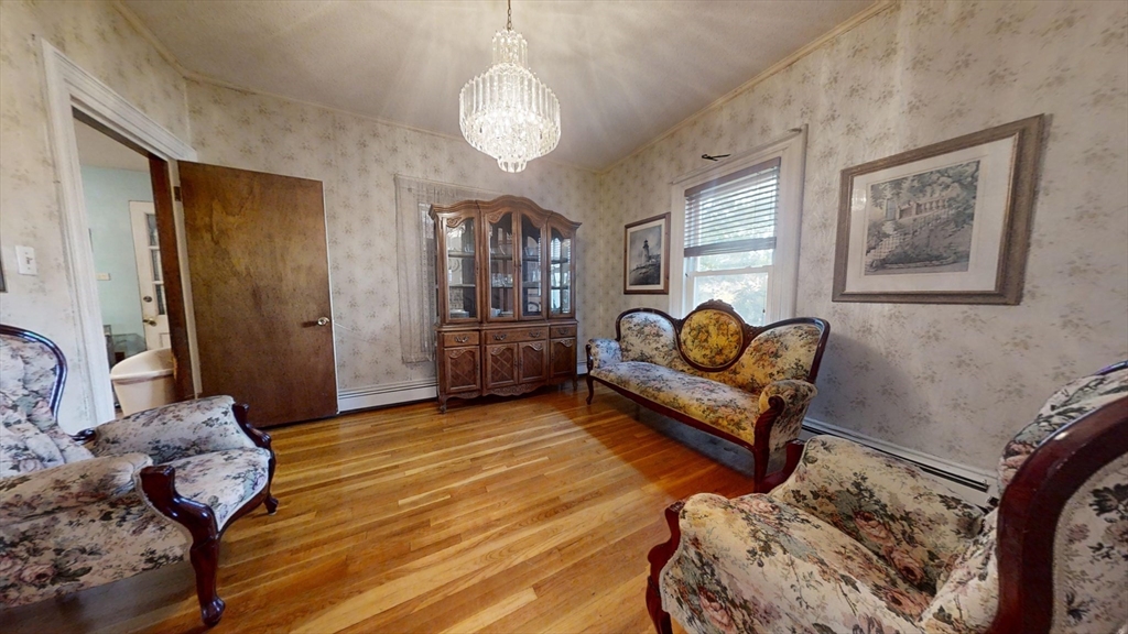57 Church Street Watertown, MA 02472 - Photo 8 of 18 a living room with furniture and wooden floor