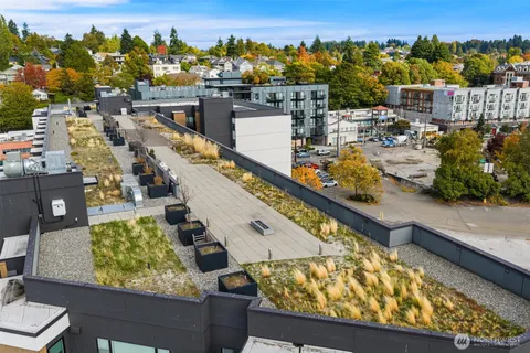 an aerial view of a residential houses with outdoor space