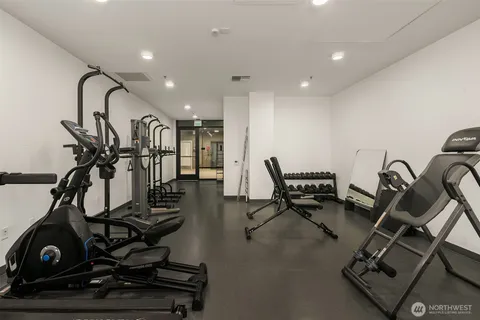 a living room with furniture wooden floor and dining table