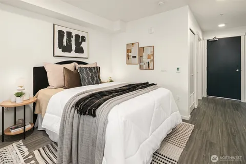 a bedroom with bed and a walk in closet