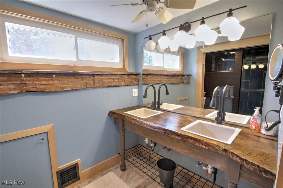 11375 Bean Road Chardon, OH 44024 - Photo 36 of 50 Full bathroom with a ceiling fan and light tile patterned floors
