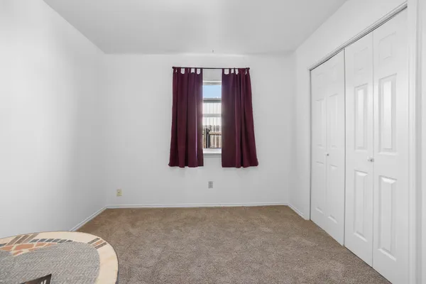 a view of a bedroom with window