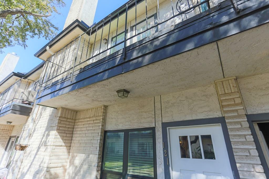 1307 Kinney Avenue, Unit 121 Austin, TX 78704 - Photo 11 of 12 a brick building with a large windows