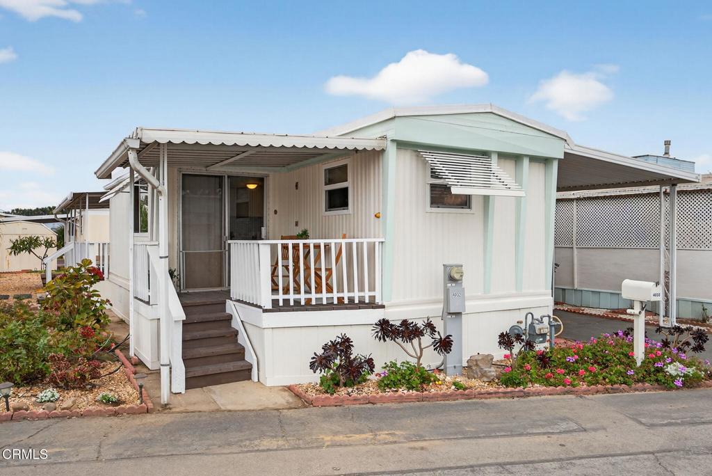 front view of a house with a bench