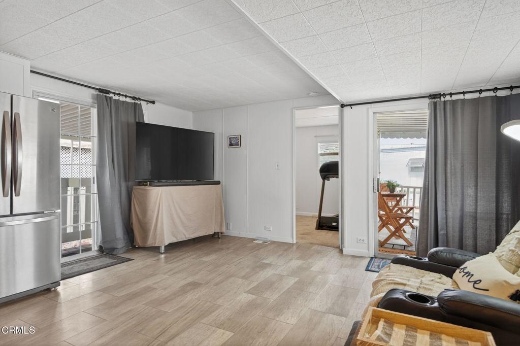 4032 Mockingbird Lane, Unit 4032 Oxnard, CA 93033 - Photo 14 of 36 a view of a livingroom with furniture and a flat screen tv