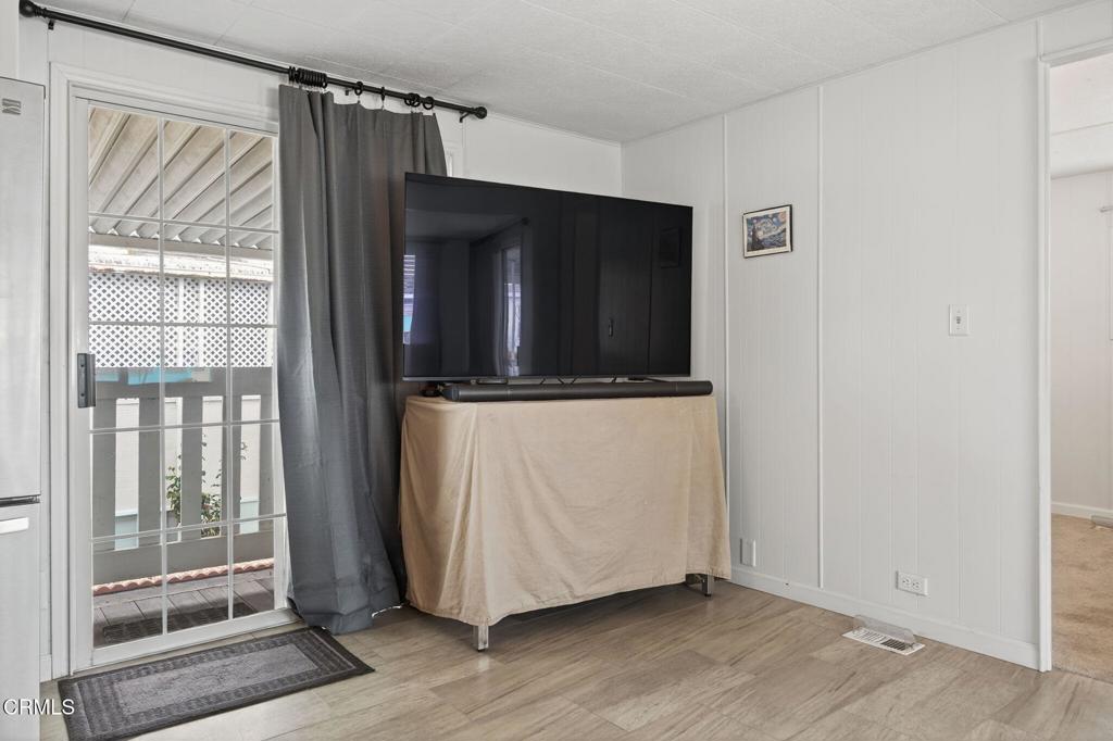4032 Mockingbird Lane, Unit 4032 Oxnard, CA 93033 - Photo 15 of 36 a view of a kitchen with wooden floor and a window