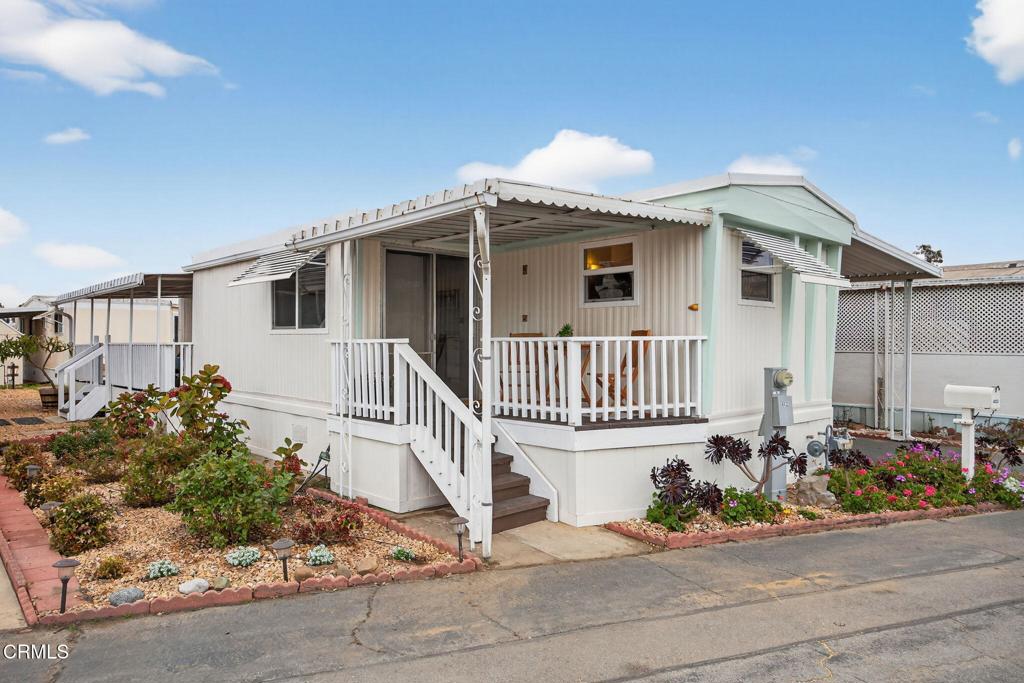 4032 Mockingbird Lane, Unit 4032 Oxnard, CA 93033 - Photo 2 of 36 a view of a house with a small yard and potted plants