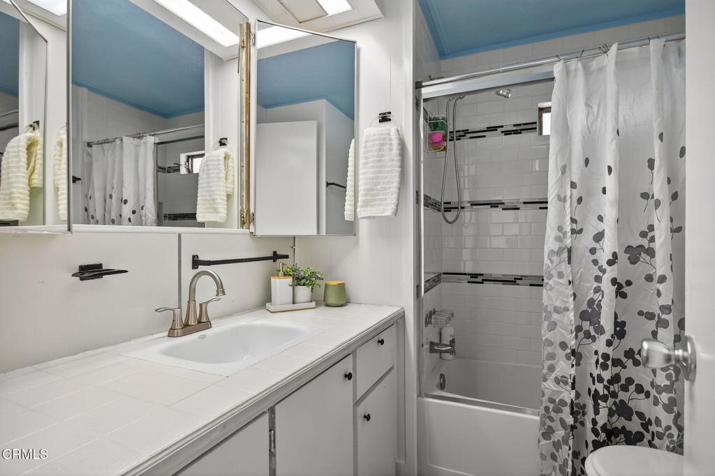 4032 Mockingbird Lane, Unit 4032 Oxnard, CA 93033 - Photo 21 of 36 a bathroom with a sink and a mirror