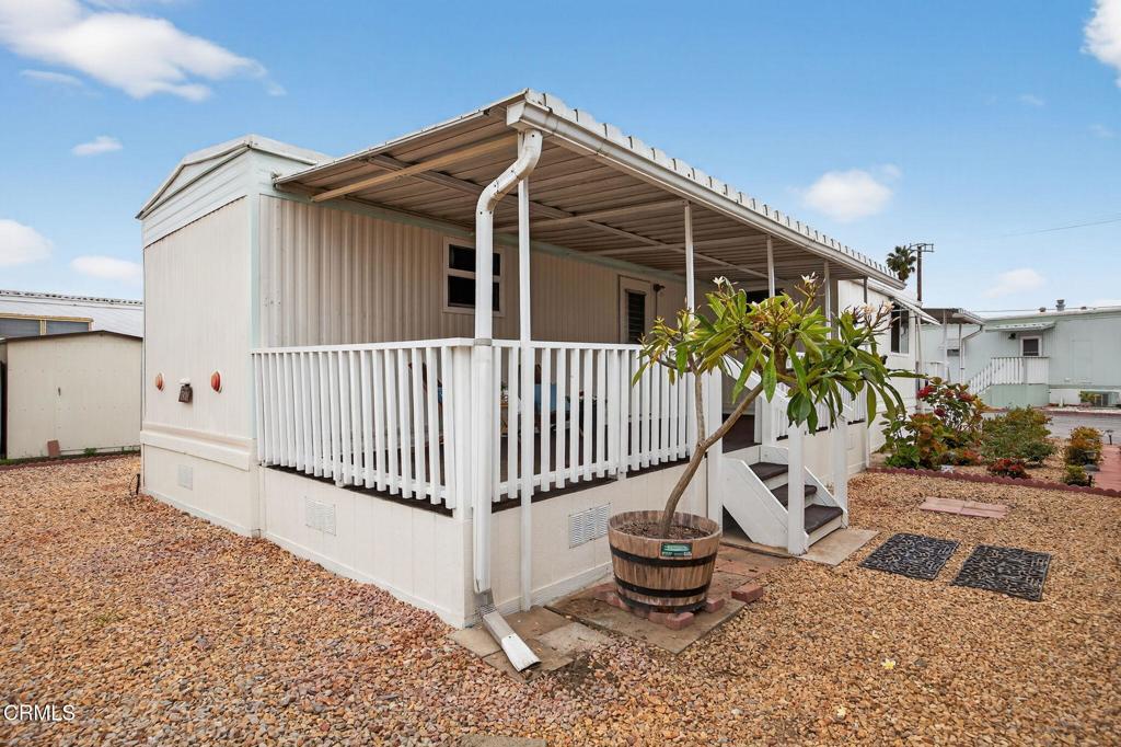 4032 Mockingbird Lane, Unit 4032 Oxnard, CA 93033 - Photo 28 of 36 a view of a house with backyard and sitting area