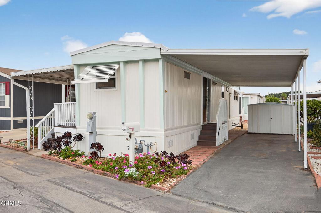 4032 Mockingbird Lane, Unit 4032 Oxnard, CA 93033 - Photo 3 of 36 a front view of a house with a porch