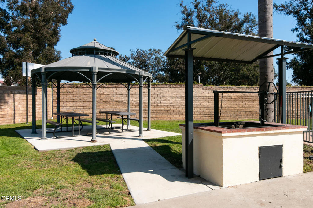 4032 Mockingbird Lane, Unit 4032 Oxnard, CA 93033 - Photo 35 of 36 a view of a swimming pool with a porch