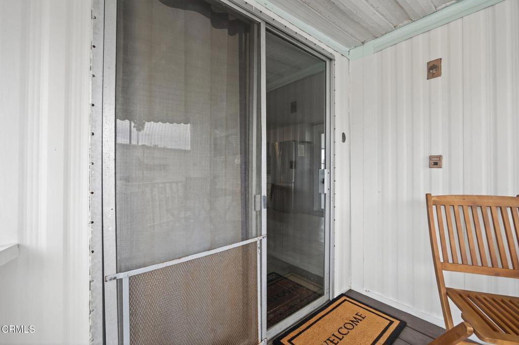 4032 Mockingbird Lane, Unit 4032 Oxnard, CA 93033 - Photo 7 of 36 a view of a hallway with wooden floor