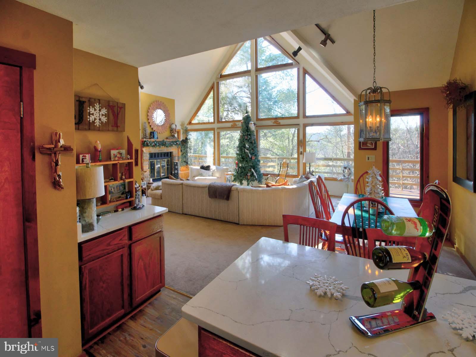 51 Forrest Street Basye, VA 22810 - Photo 13 of 27 a living room with furniture and a floor to ceiling window