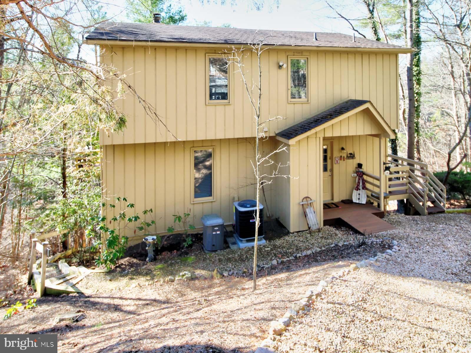 51 Forrest Street Basye, VA 22810 - Photo 2 of 27 a front view of a house with garden