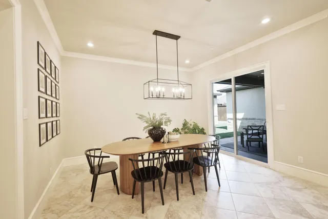 a view of kitchen with furniture and refrigerator