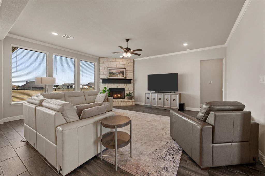 15220 South County Line Road Justin, TX 76247 - Photo 1 of 1 a living room with furniture and a flat screen tv