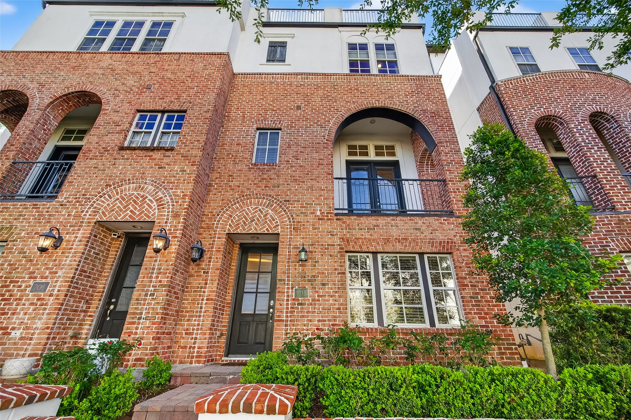 705 Delano Street Houston, TX 77003 - Photo 1 of 47 a front view of a house with a garden