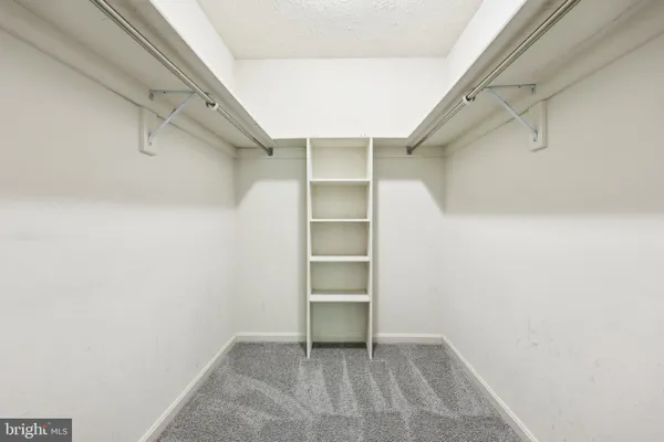 a view of an empty walk in closet