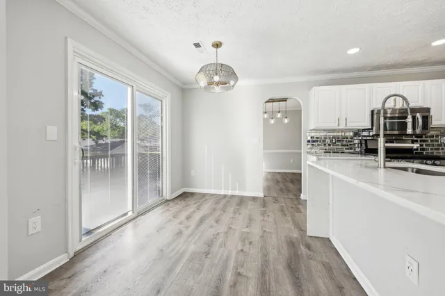 a view of a kitchen from the hallway
