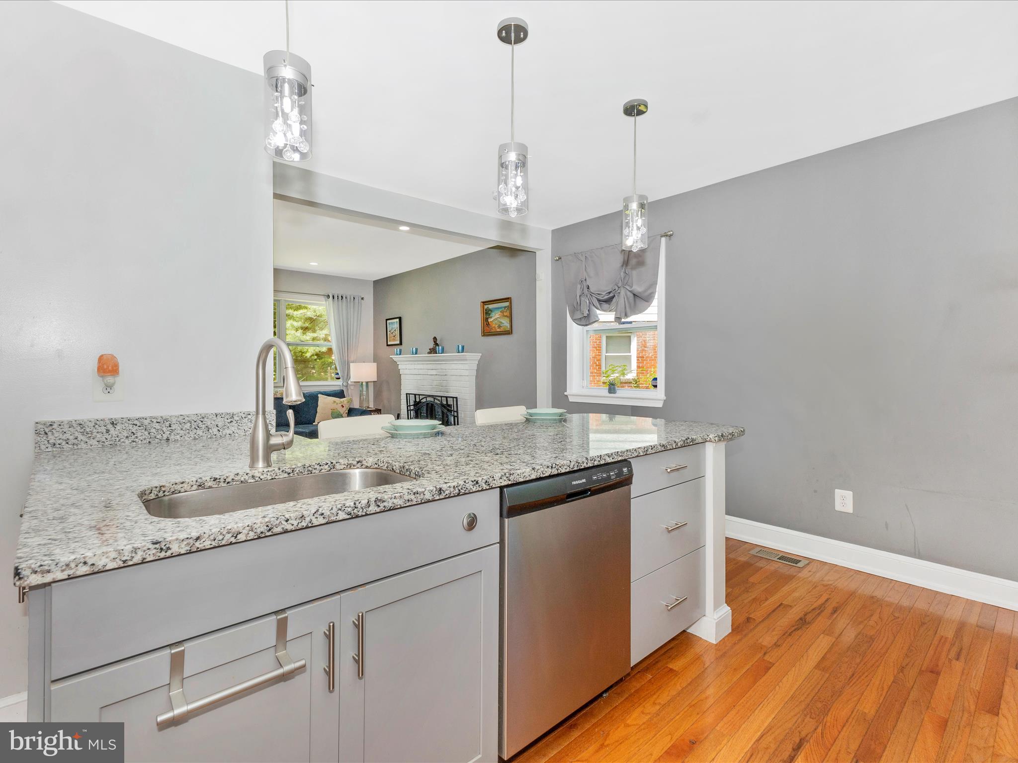 507 Kerwin Court Silver Spring, MD 20901 - Photo 12 of 51 a kitchen with granite countertop a sink cabinets and wooden floor
