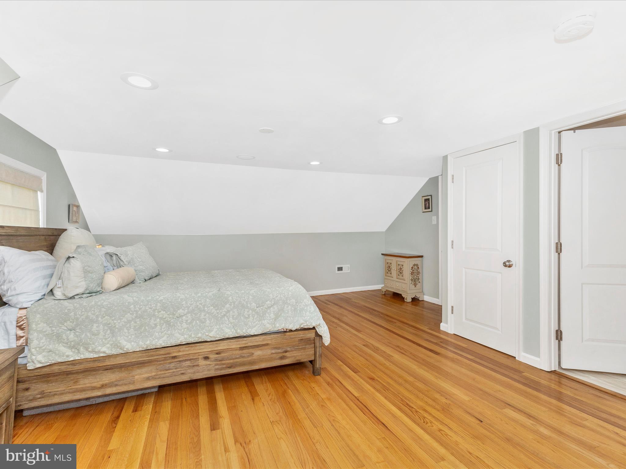 507 Kerwin Court Silver Spring, MD 20901 - Photo 17 of 51 a bedroom with a bed and a wooden floor