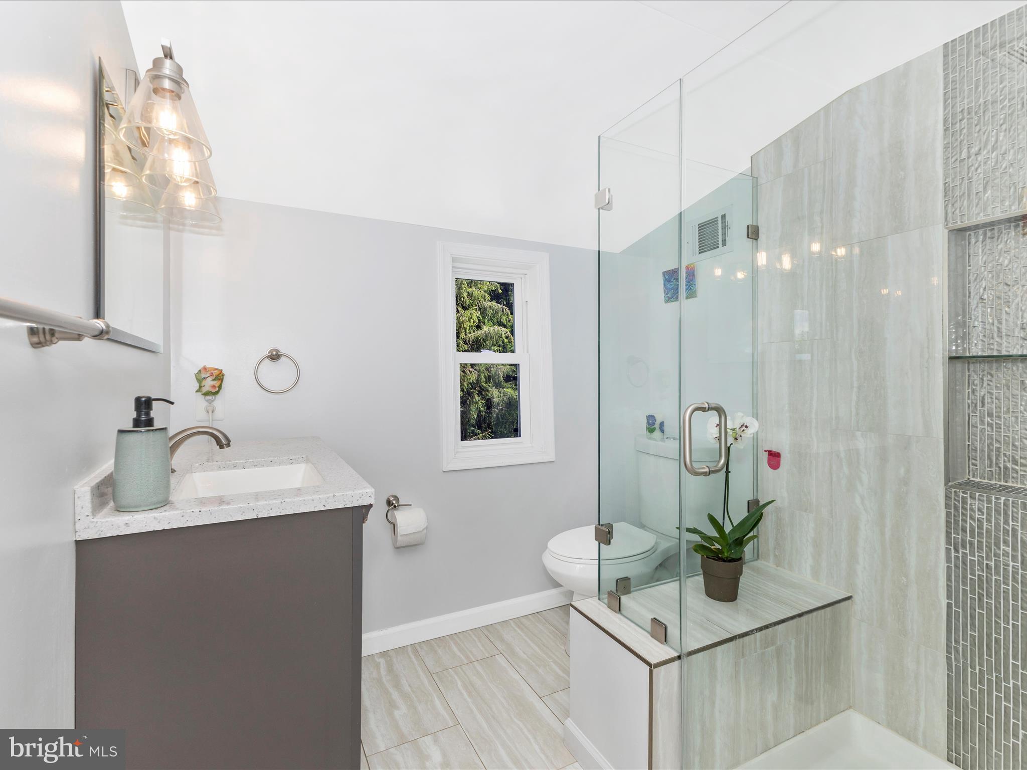 507 Kerwin Court Silver Spring, MD 20901 - Photo 19 of 51 a bathroom with a sink vanity granite and a mirror