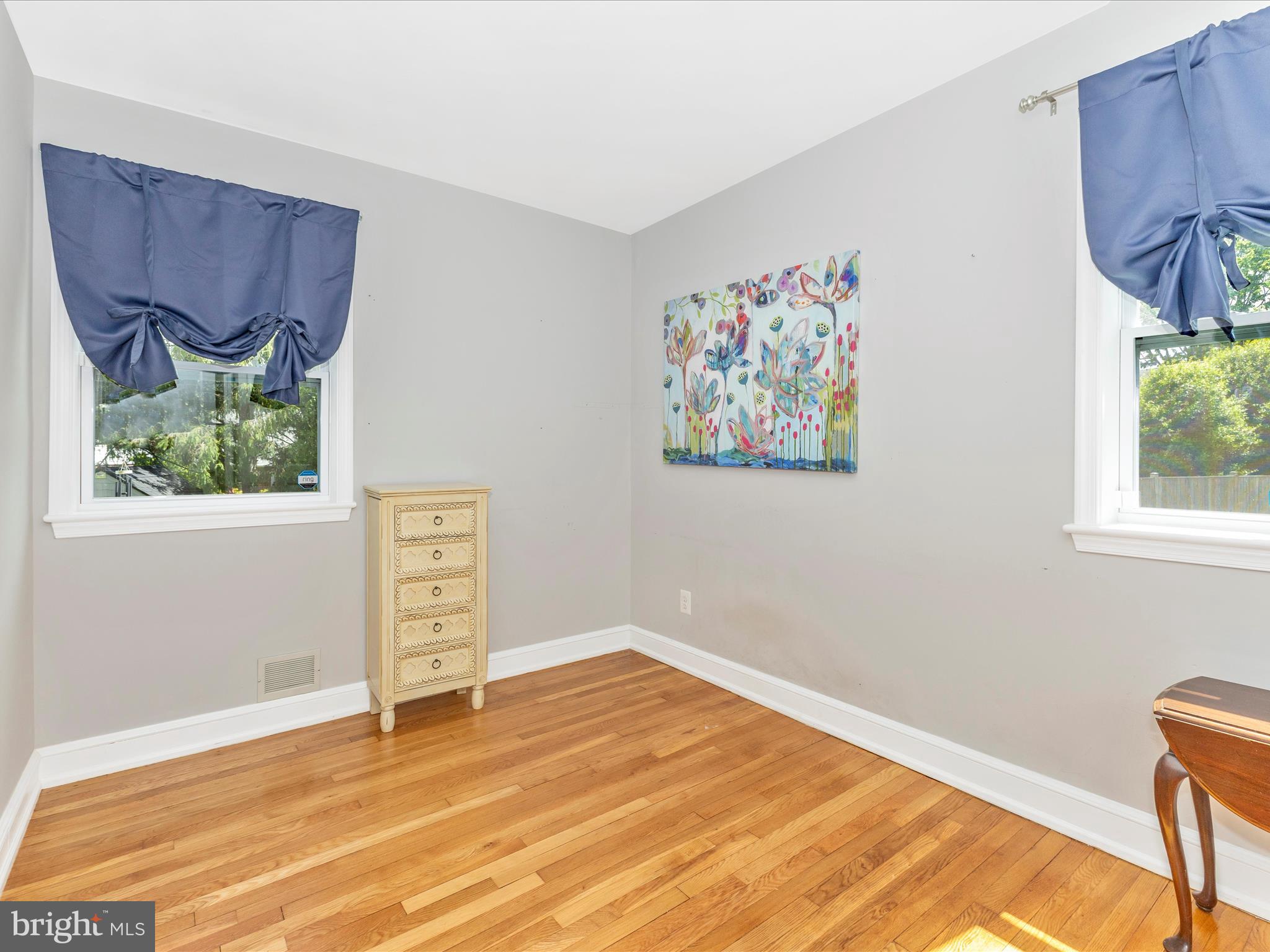 507 Kerwin Court Silver Spring, MD 20901 - Photo 24 of 51 a view of an empty room with a window and wooden floor