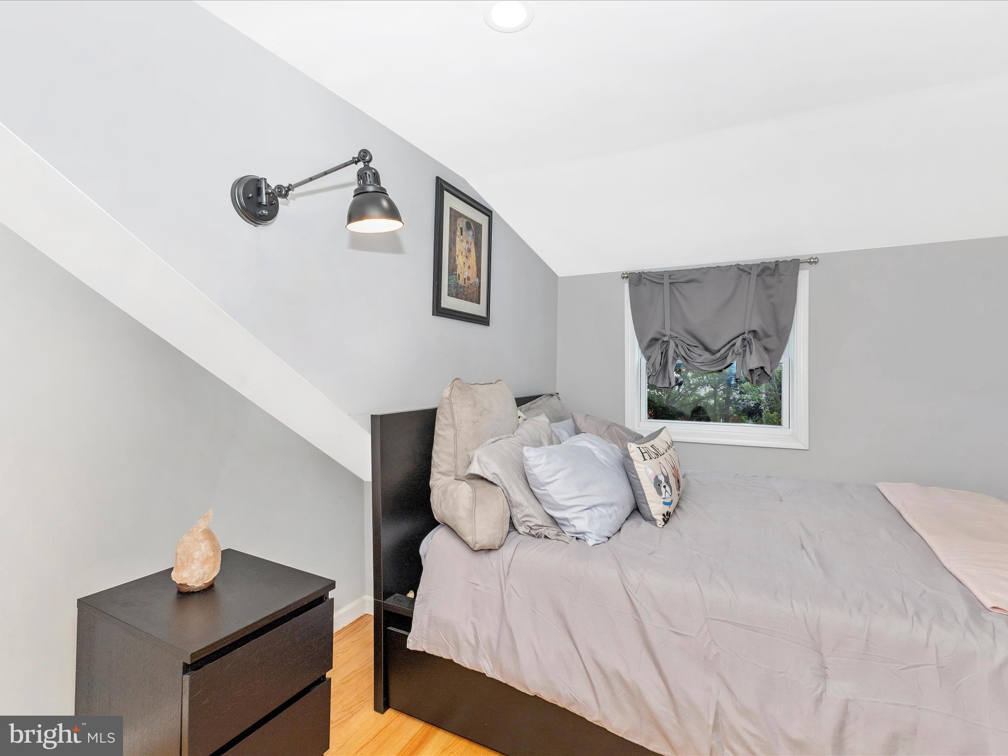 507 Kerwin Court Silver Spring, MD 20901 - Photo 28 of 51 a bedroom with a bed and wooden floor